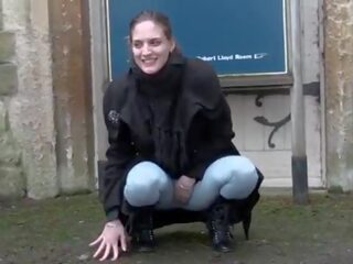 Passionate lassie pisses in leggings and movs her tits in public